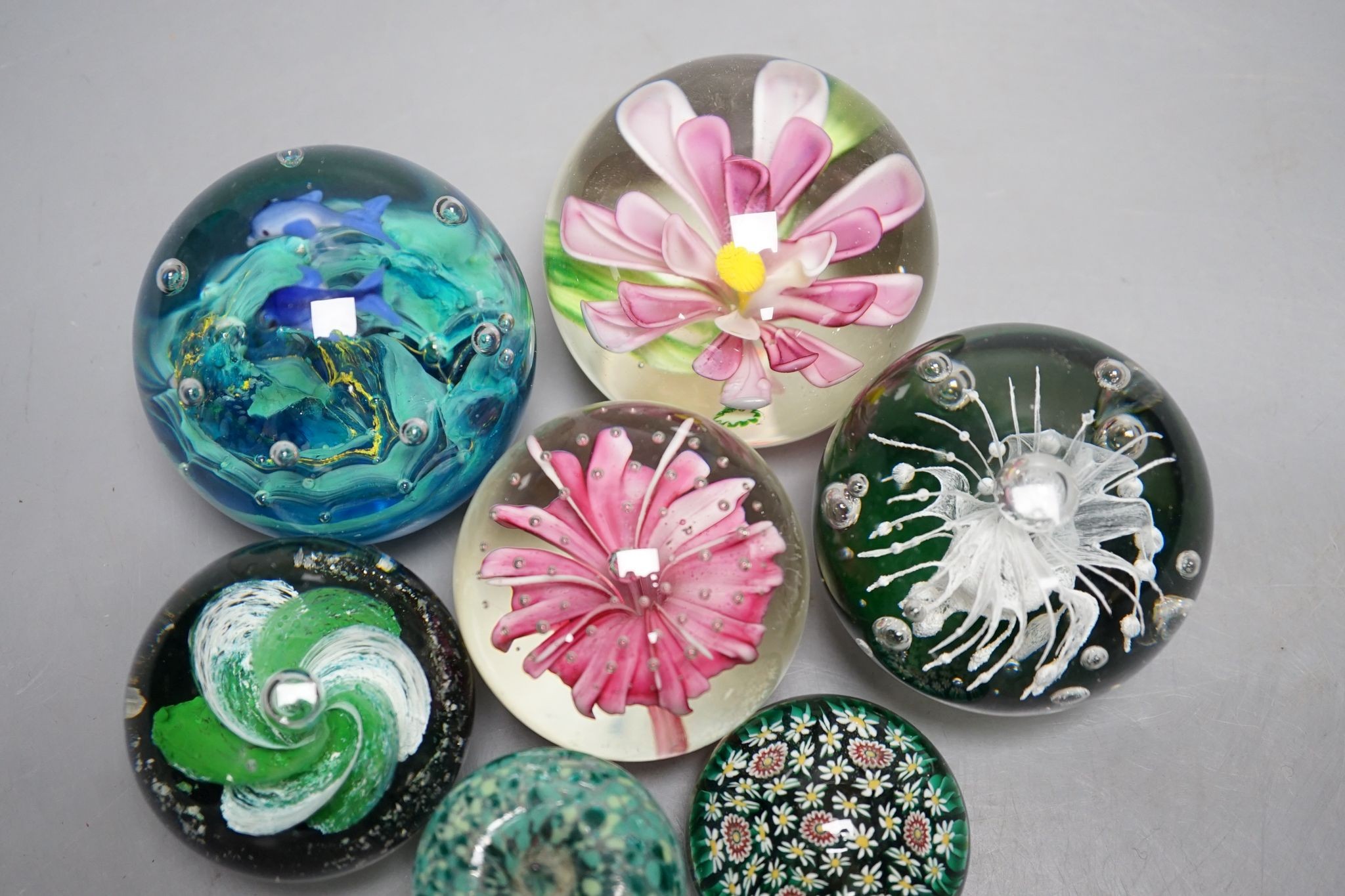 A group of glass paperweights including Caithness